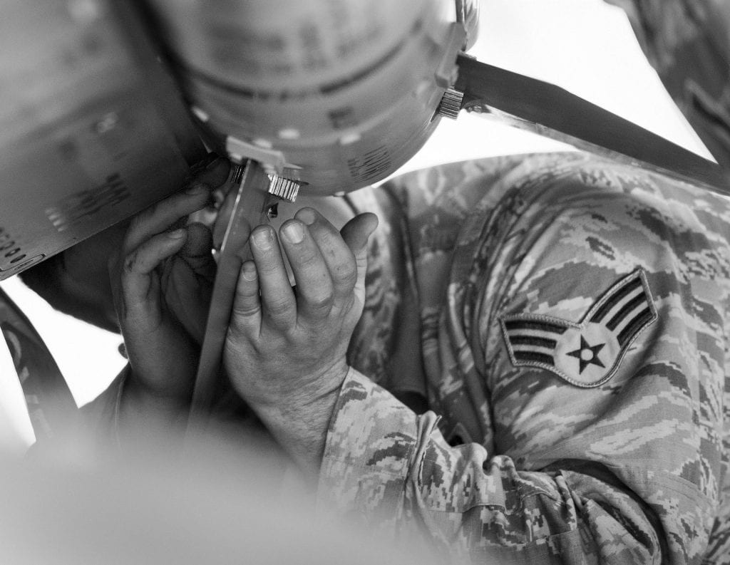 BogiDope, an airmen loads a air-to-air missile prior to takeoff.